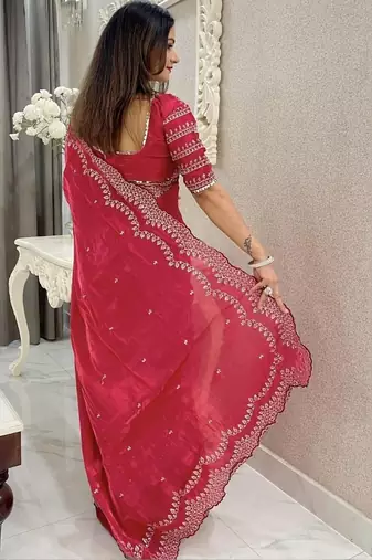 Red ethnic motifs embroidered silk blend saree
