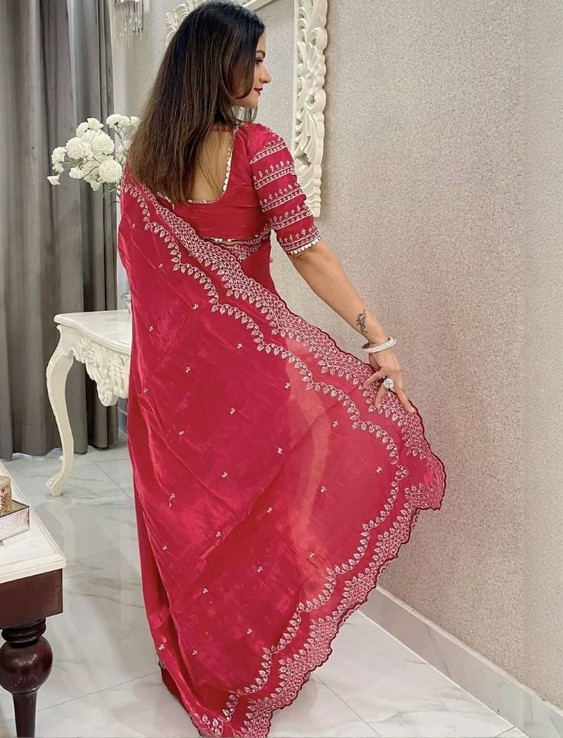 Red ethnic motifs embroidered silk blend saree