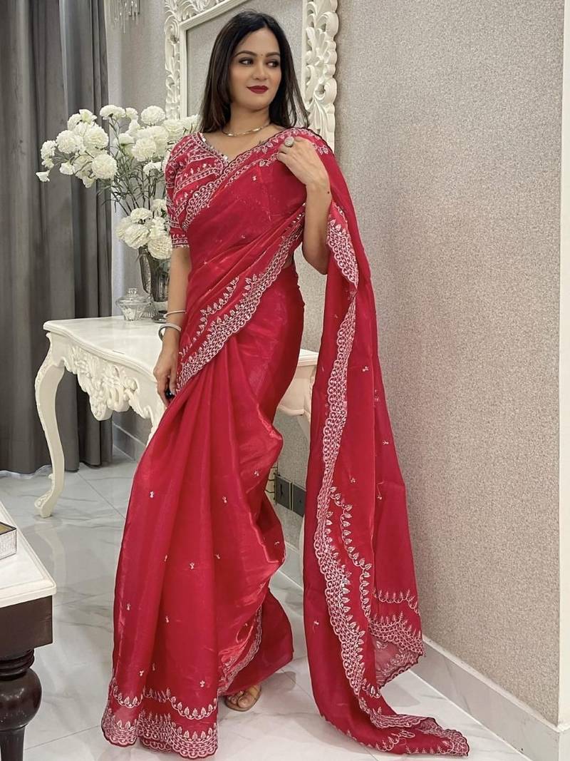 Red ethnic motifs embroidered silk blend saree