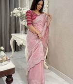 Pink ethnic motifs embroidered silk blend saree