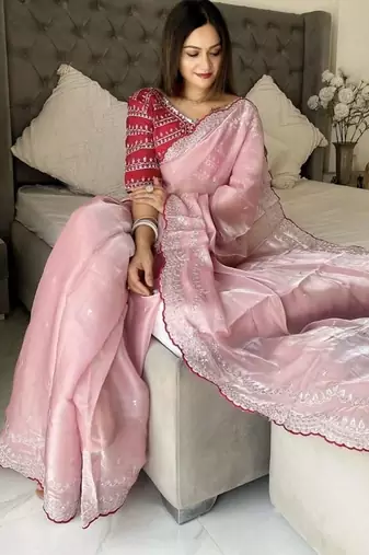 Pink ethnic motifs embroidered silk blend saree