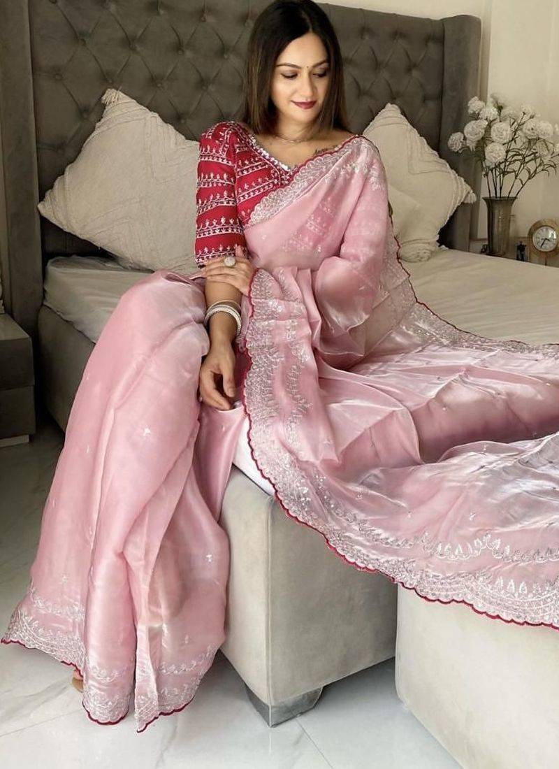Pink ethnic motifs embroidered silk blend saree