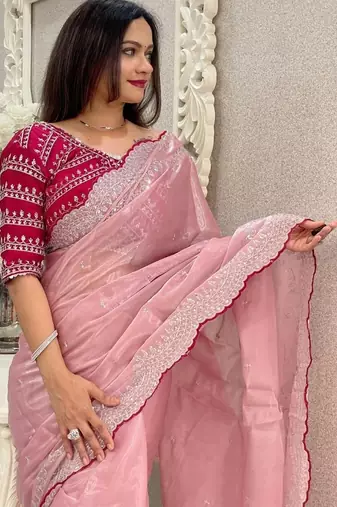 Pink ethnic motifs embroidered silk blend saree
