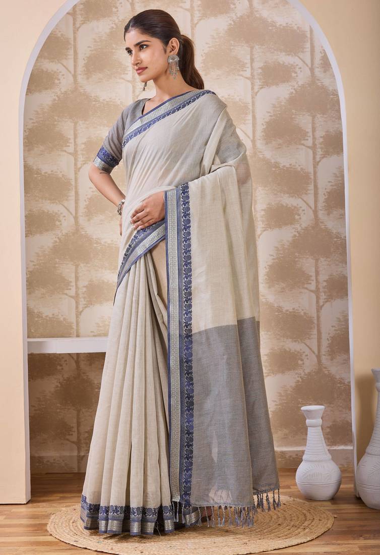 Ash grey zari and thread work border cotton blend saree with tassels with blouse