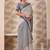 Ash grey zari and thread work border cotton blend saree with tassels with blouse