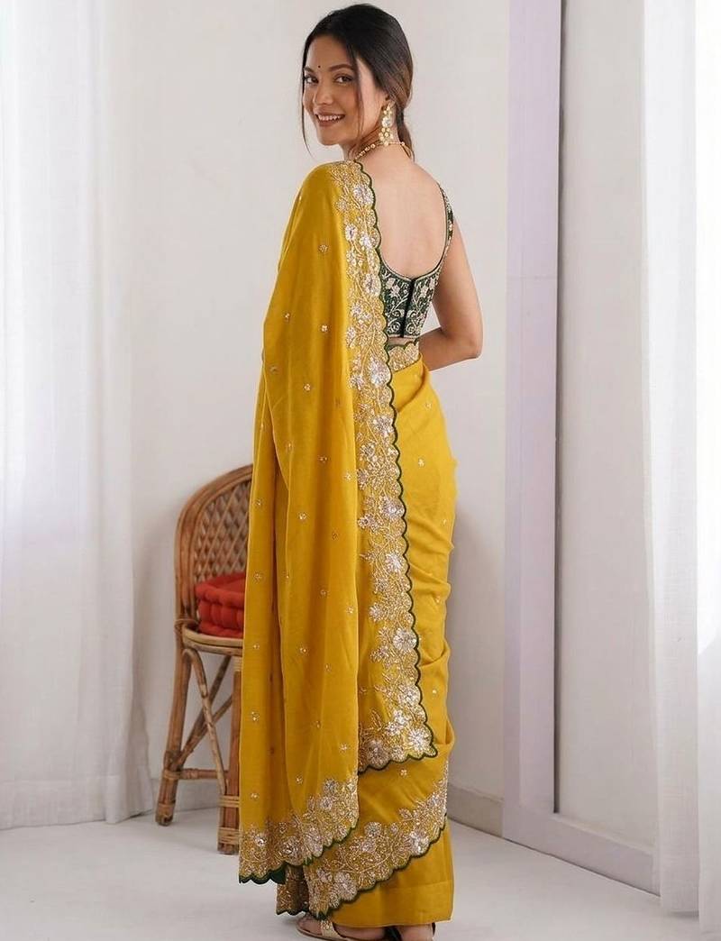 Yellow embellished embroidered pure georgette heavy work saree