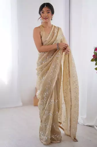Cream embroidered sequinned saree with blouse piece