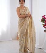 Cream embroidered sequinned saree with blouse piece