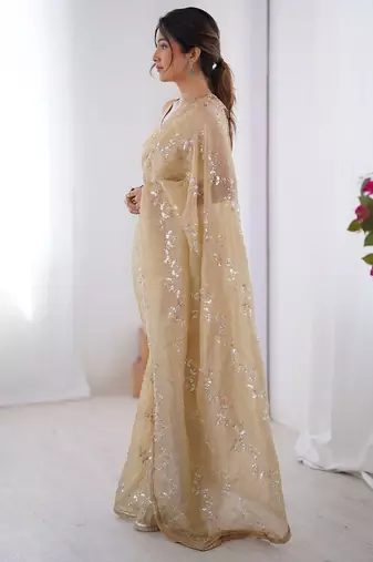 Cream embroidered sequinned saree with blouse piece