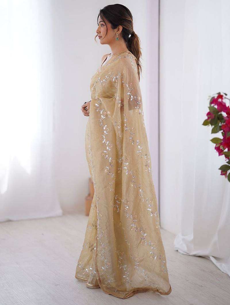 Cream embroidered sequinned saree with blouse piece