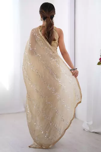 Cream embroidered sequinned saree with blouse piece