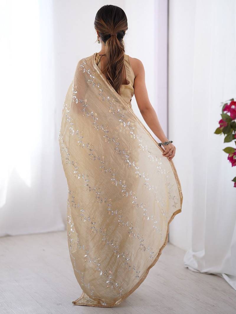 Cream embroidered sequinned saree with blouse piece