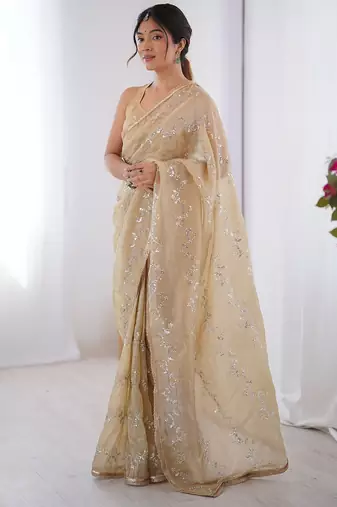 Cream embroidered sequinned saree with blouse piece