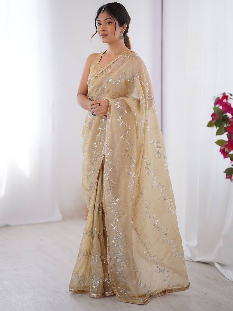 Cream embroidered sequinned saree with blouse piece