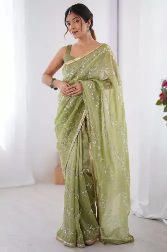 Green women ethnic motifs embroidered beads and stones embellished saree