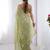 Green women ethnic motifs embroidered beads and stones embellished saree