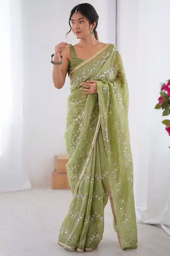 Green women ethnic motifs embroidered beads and stones embellished saree