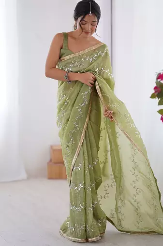 Green women ethnic motifs embroidered beads and stones embellished saree