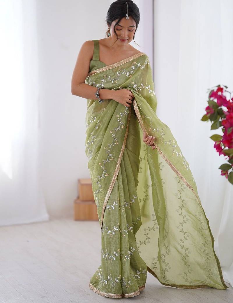Green women ethnic motifs embroidered beads and stones embellished saree