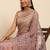 Pink embroidered beads and stones embellished net saree