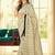Cream ethnic motifs printed saree