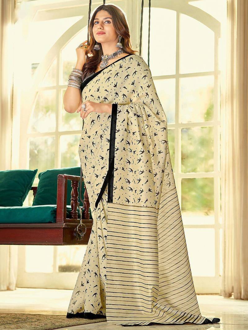Cream ethnic motifs printed saree