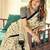 Cream ethnic motifs printed saree