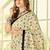 Cream ethnic motifs printed saree