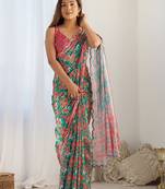 Green ethnic motifs printed mirror work border saree with blouse piece