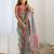 Green ethnic motifs printed mirror work border saree with blouse piece