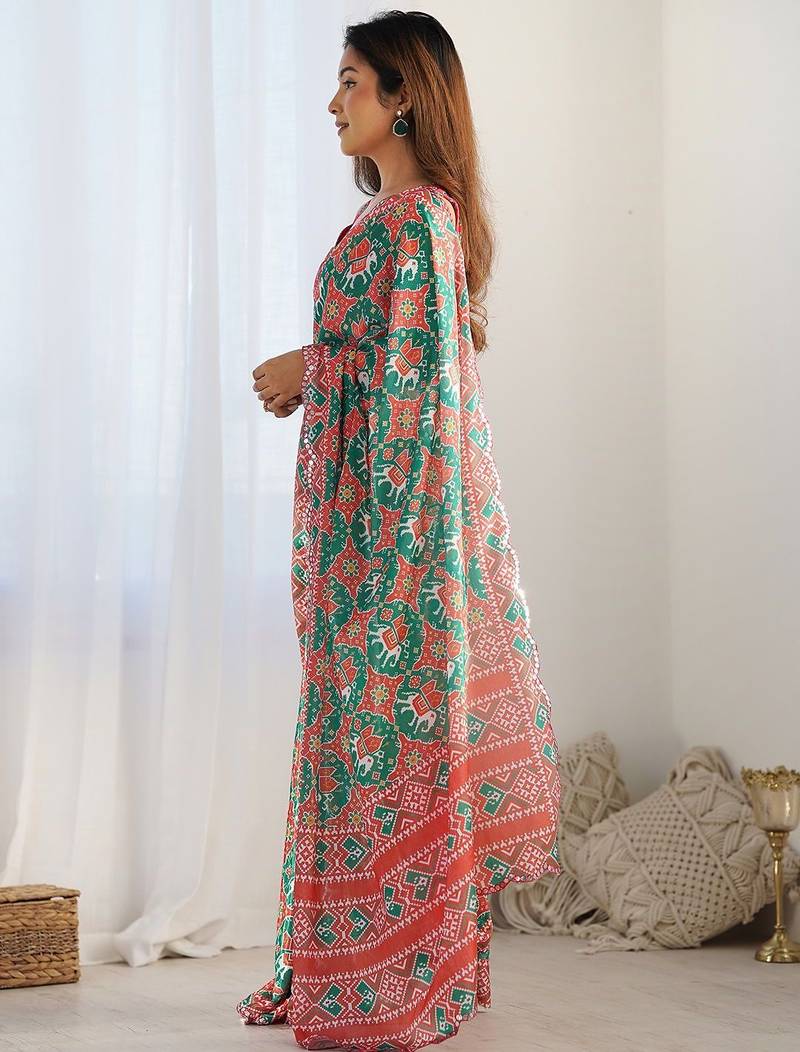 Green ethnic motifs printed mirror work border saree with blouse piece