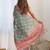 Green ethnic motifs printed mirror work border saree with blouse piece