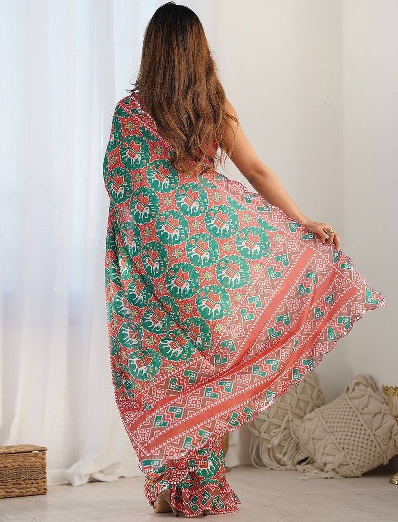 Green ethnic motifs printed mirror work border saree with blouse piece