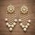 White pearl kundan tassle earrings