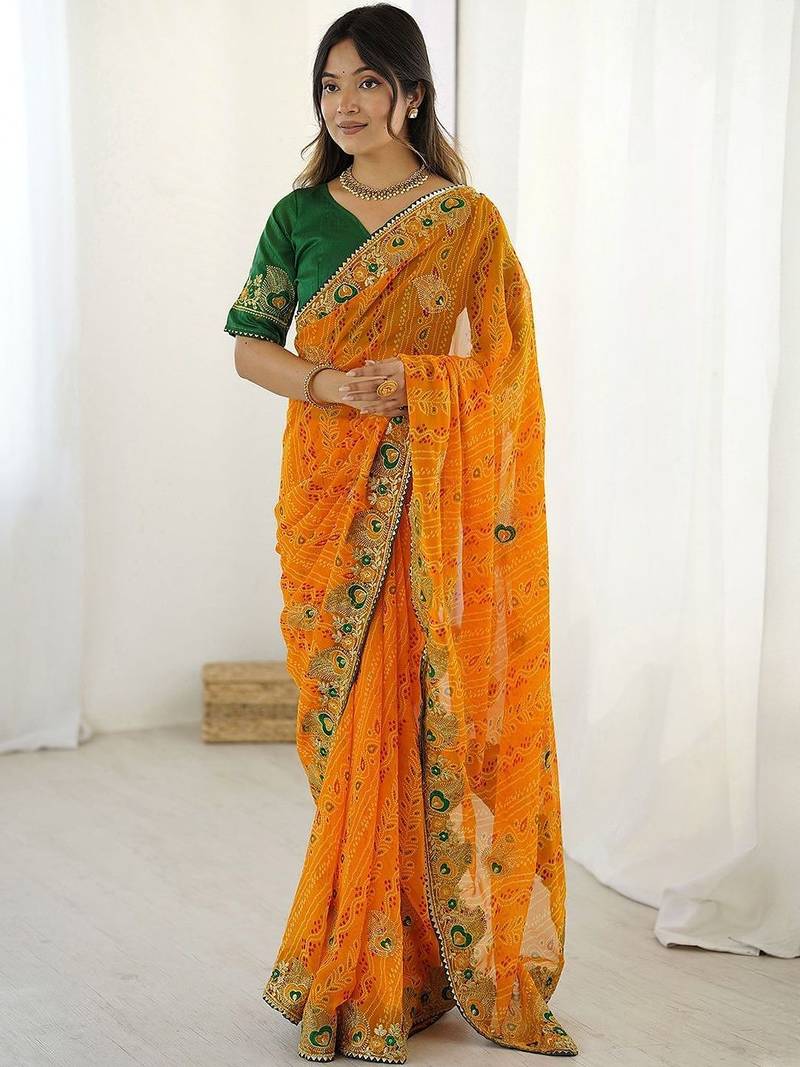 Orange ethnic motifs embroidered pure georgette saree
