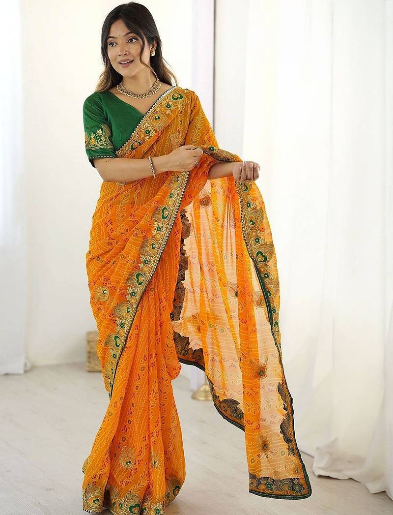 Orange ethnic motifs embroidered pure georgette saree