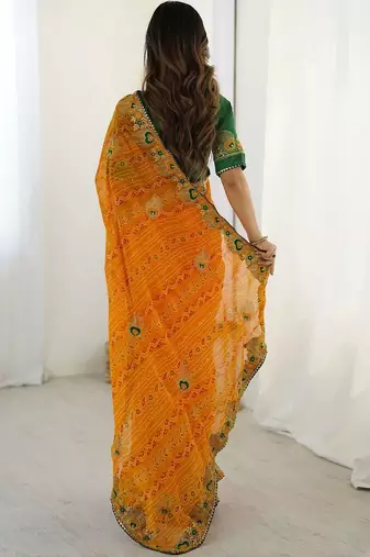 Orange ethnic motifs embroidered pure georgette saree