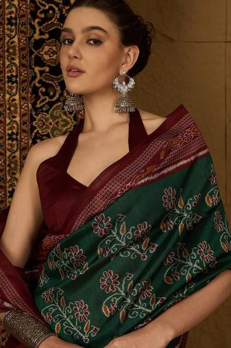 Green ethnic motifs silk cotton ikat saree
