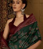 Green ethnic motifs silk cotton ikat saree