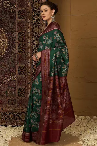 Green ethnic motifs silk cotton ikat saree