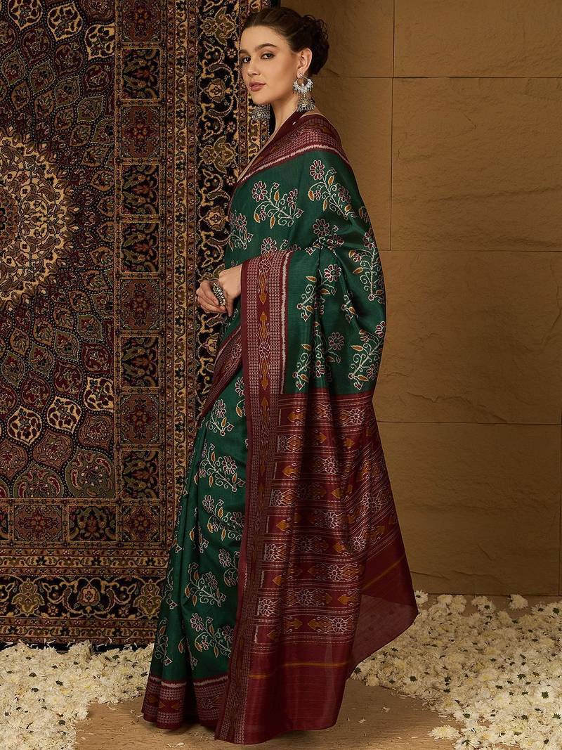 Green ethnic motifs silk cotton ikat saree