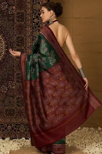 Green ethnic motifs silk cotton ikat saree