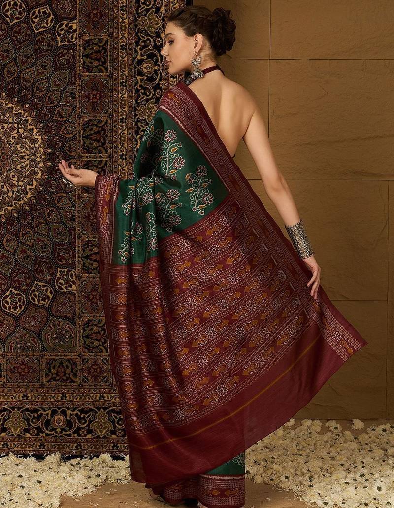 Green ethnic motifs silk cotton ikat saree