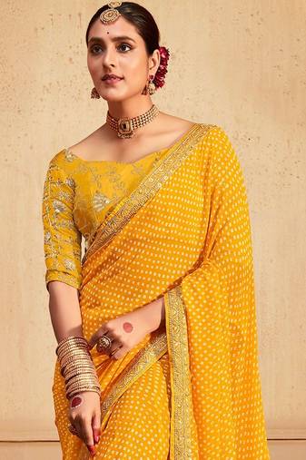 Yellow printed sequinned poly georgette bandhani saree