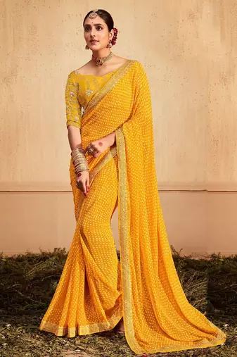 Yellow printed sequinned poly georgette bandhani saree