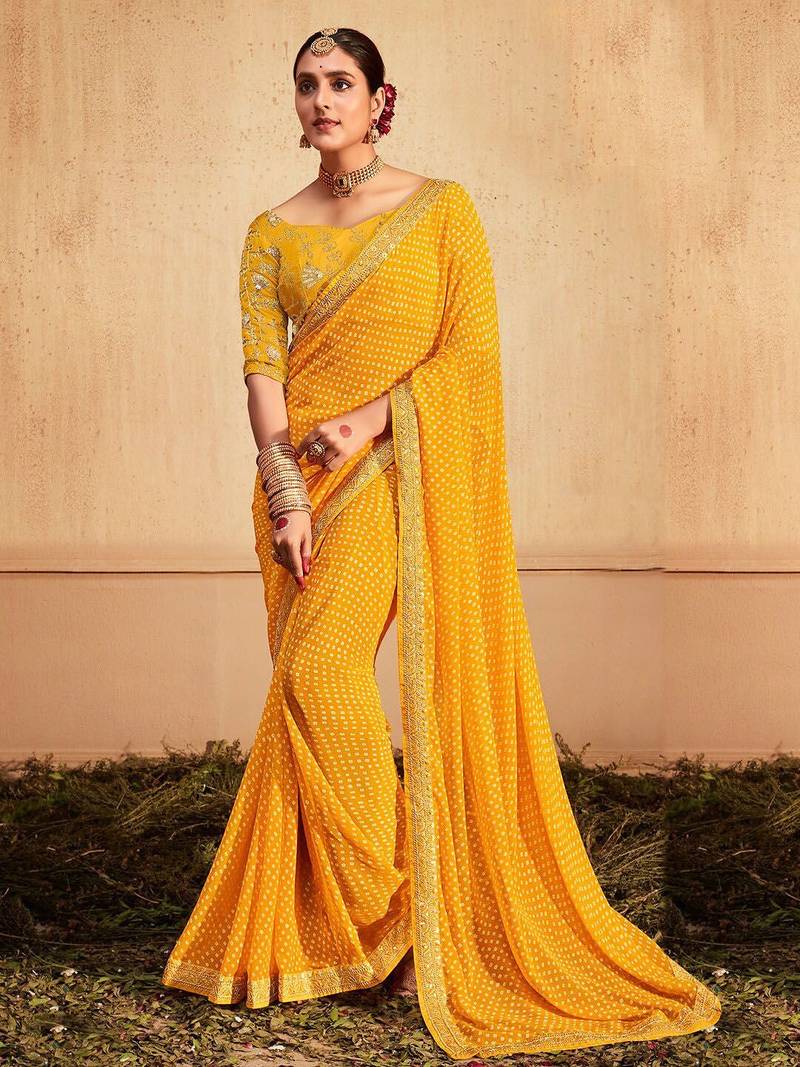 Yellow printed sequinned poly georgette bandhani saree