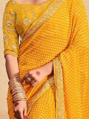 Yellow printed sequinned poly georgette bandhani saree 3