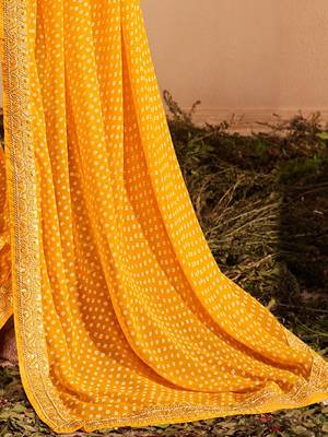 Yellow printed sequinned poly georgette bandhani saree 4