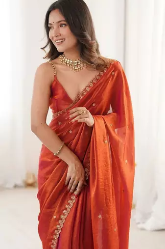 Rust ethnic motifs embroidered bagh saree