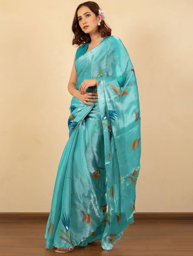 Turquoise floral organza saree